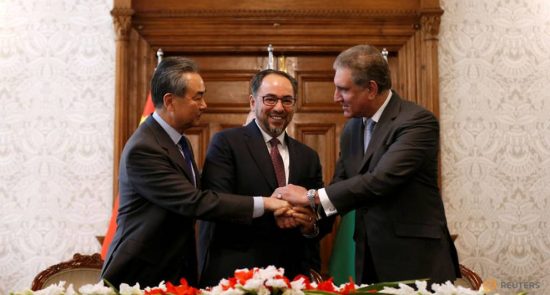 afghanistan s fm rabbani pakistan s fm shah mehmood qureshi and chinese foreign minister wang shake hands after memorandum of understanding on cooperation in fighting terrorism signed in kabul 2 550x295 - Kabul Trilateral Talks; China Pledges to Help Longstanding Afghan-Pakistan Suspicions