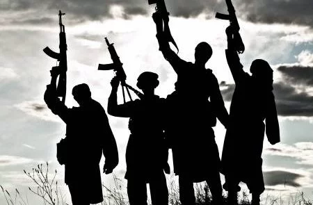 20041553 silhouette of several muslim militants with rifles 450x295 - Islamic State Staggers in Afghanistan, but Survives
