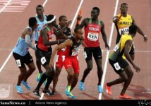 Athletes in a tangle at the baton exchange in the men’s 4x400m relay final. Botswana would win gold.