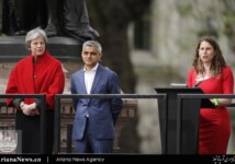 Theresa May and Sadiq Khan listen as the activist Caroline Criado Perez speaks